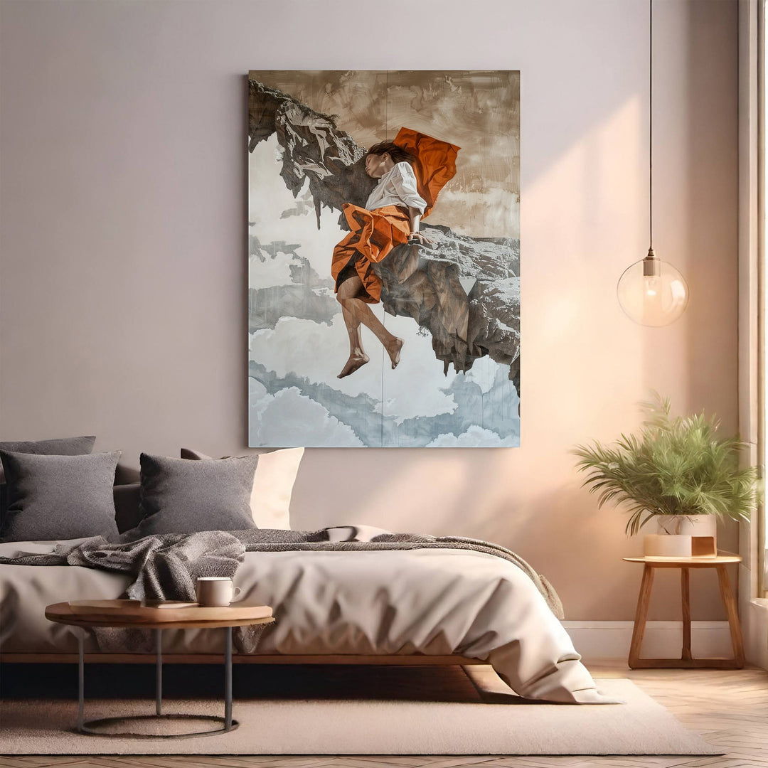 Wadi Home dramatic wall art of a figure in orange attire on a rocky outcrop with clouds.