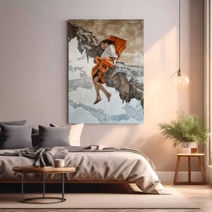 Wadi Home dramatic wall art of a figure in orange attire on a rocky outcrop with clouds.
