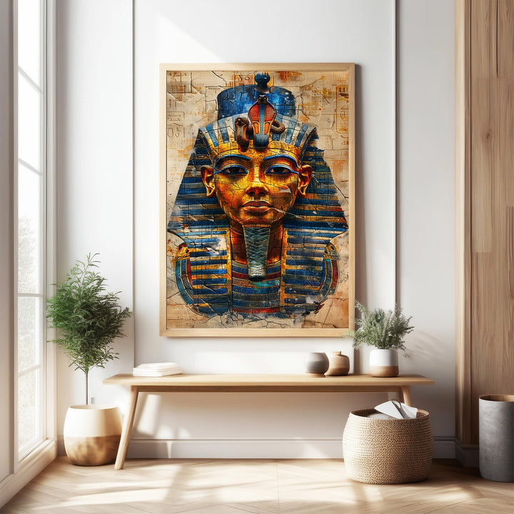 Wadi Home Ancient Egyptian Pharaoh portrait wall art with gold, blue, and red details, framed in light wood. Textured background.