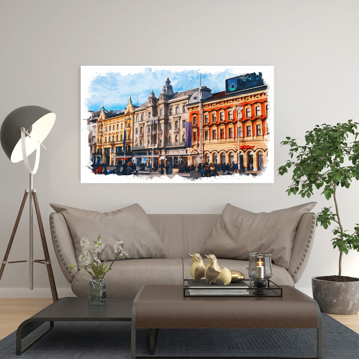 Wadi Home European cityscape watercolor wall art with detailed architecture and vibrant colors, displayed above a sofa.