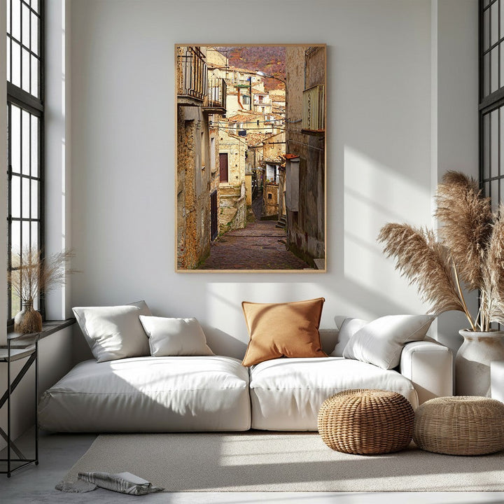 Wadi Home European village street scene wall art with rustic buildings and balconies, warm tones.