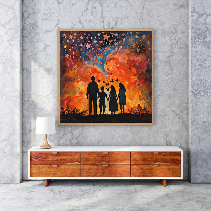 Wadi Home starry sky family wall art with vibrant orange, red, and blue celestial clouds and silhouettes of a family holding hands.