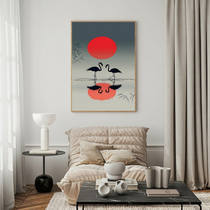 Wadi Home Flamingo Sunset Reflection Wall Art featuring two black flamingos silhouetted against a red sun with reflections.