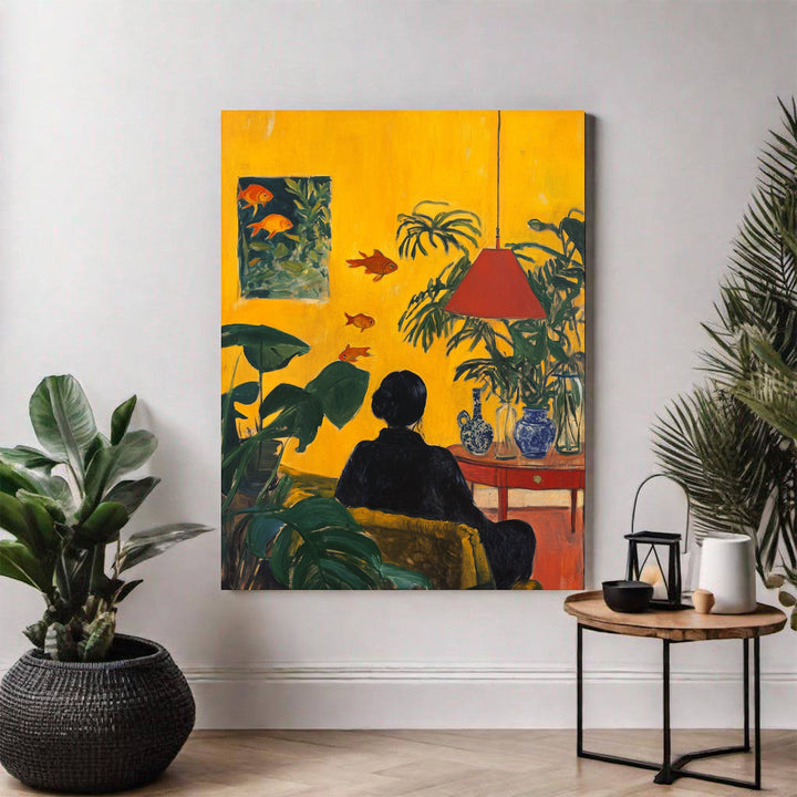 Wadi Home Golden Hour Serenity Wall Art painting of a woman in black relaxing on a yellow couch, surrounded by lush green plants and swimming goldfish.