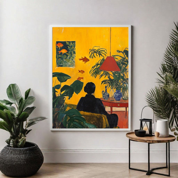 Wadi Home Golden Hour Serenity Wall Art: Woman in black relaxing in a yellow room with plants and goldfish.