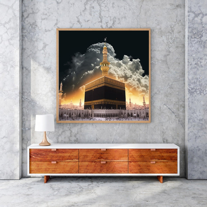 Wadi Home Islamic Kaaba artwork featuring the Kaaba in Mecca bathed in golden light with dramatic clouds and surrounding architecture.