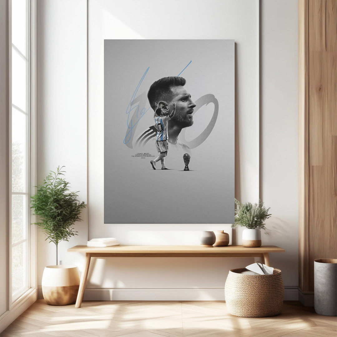 Wadi Home framed wall art featuring Lionel Messi in his Argentina jersey, with his signature and a trophy graphic. Minimalist design.