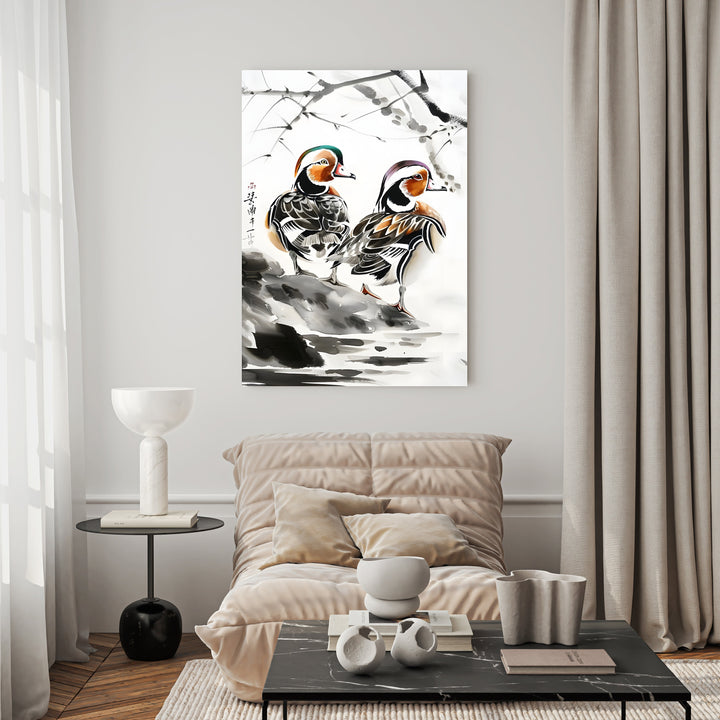 Wadi Home watercolor painting of two mandarin ducks on a rocky shore with subtle ink brushstrokes and blossoming branches.