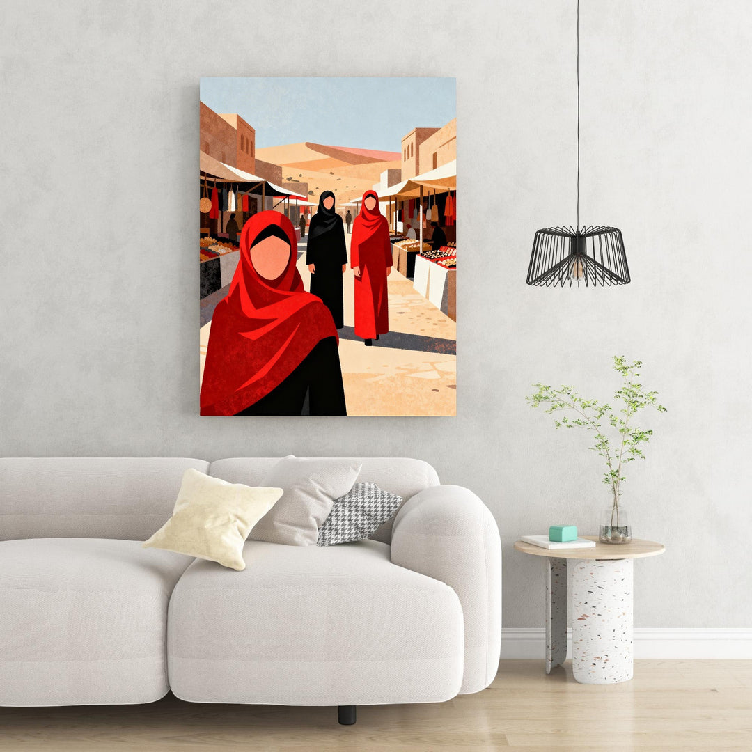 Wadi Home art print of women in traditional red and black attire walking through a vibrant marketplace with stalls and desert scenery.
