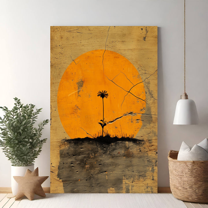 Wadi Home minimalist wall art: single black flower silhouette against textured orange sun, distressed earthy background.