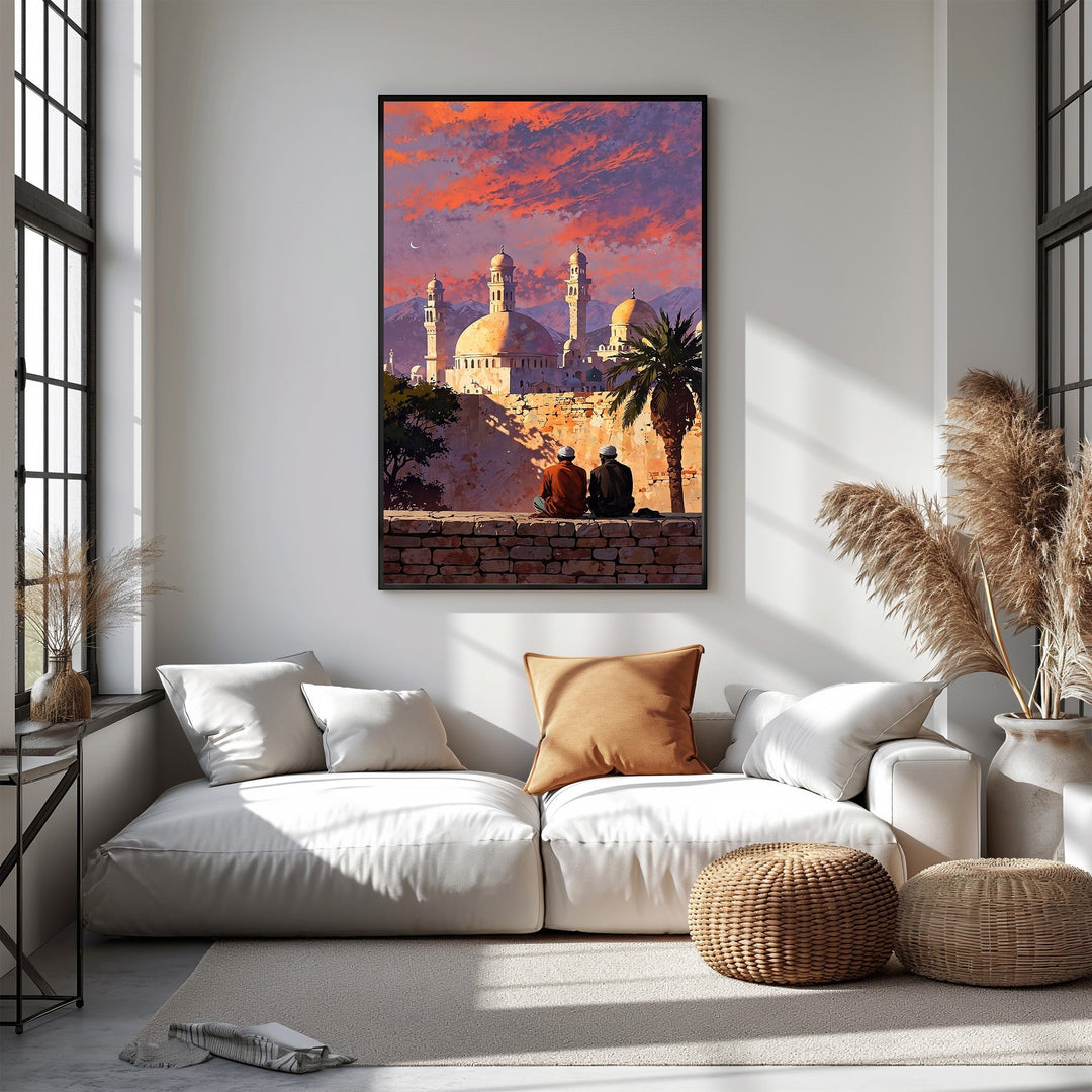 Wadi Home mosque sunset wall art with vibrant orange, purple, and pink sky, featuring Islamic architecture, mountains, and a palm tree. Two figures sit on a wall.