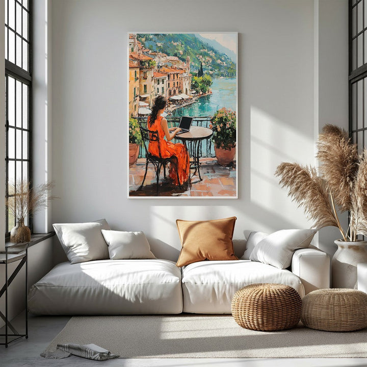 Wadi Home oil painting of a woman in an orange dress working on a laptop by a lake with colorful buildings.