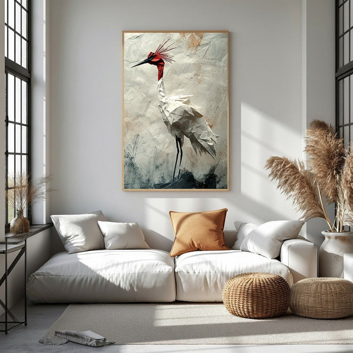 Wadi Home white origami crane wall art with red crest on textured background, framed in light wood.