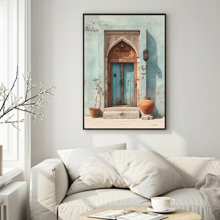 Wadi Home Ornate archway with distressed blue double doors, detailed carvings, and terracotta pots. Light blue textured wall.