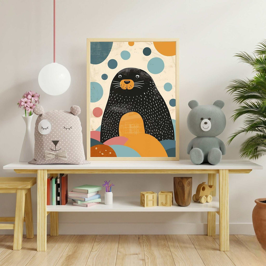 Wadi Home framed wall art of a black seal with white whiskers surrounded by abstract orange, blue, and pink bubbles.