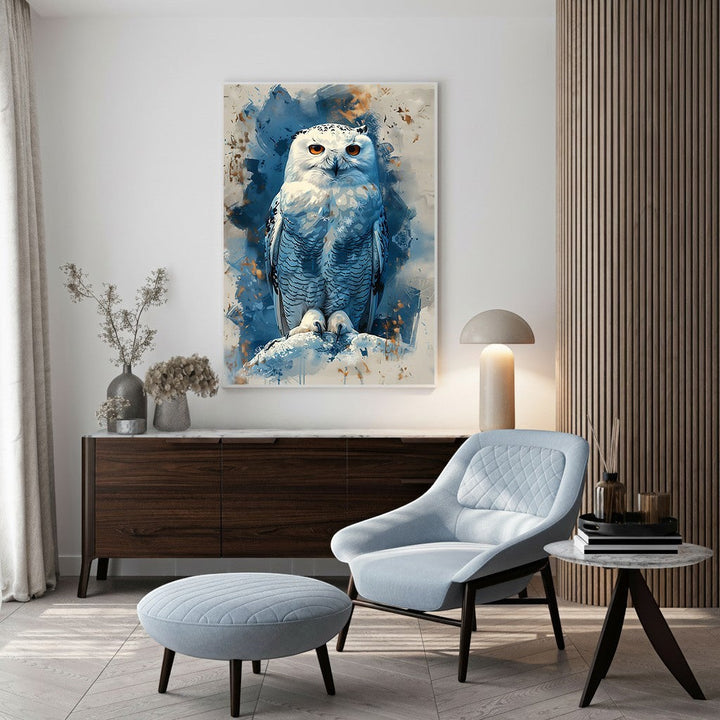Wadi Home Majestic Snowy Owl watercolor art with piercing orange eyes, set against a cool blue and white abstract background.