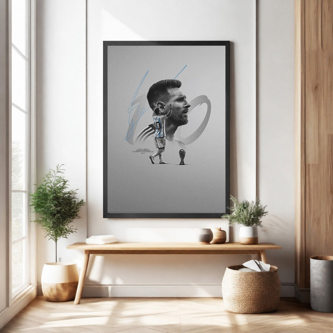 Wadi Home framed wall art featuring a portrait of soccer legend Lionel Messi in his blue and white jersey, with his signature and a trophy graphic.