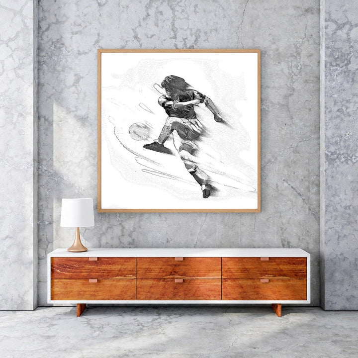 Wadi Home black and white sketch art of a soccer player in mid-kick, conveying energy and speed.
