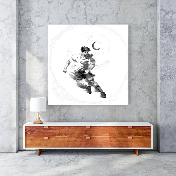 Wadi Home black and white sketch artwork of a soccer player dribbling a ball under a crescent moon.