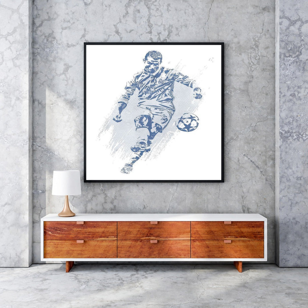 Wadi Home blue and white soccer player action shot wall art, stylized depiction of player kicking ball, abstract textured background.