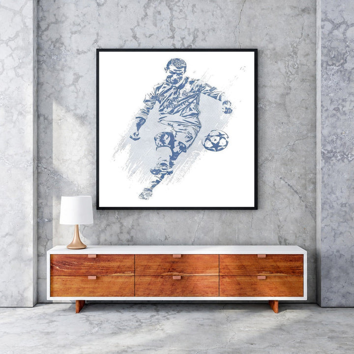 Wadi Home blue and white soccer player action shot wall art, stylized depiction of player kicking ball, abstract textured background.
