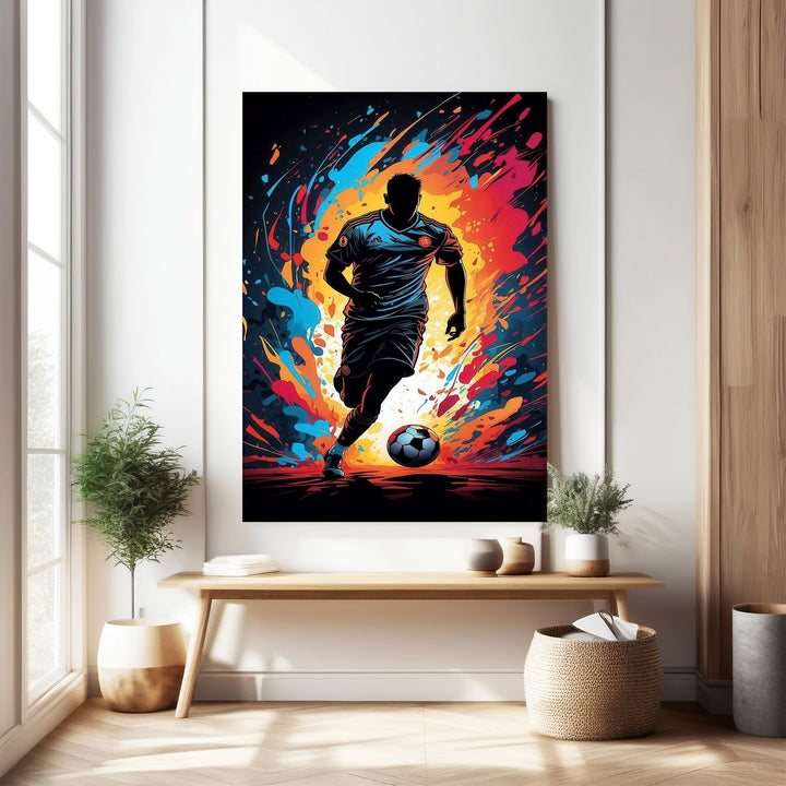 Wadi Home dynamic soccer player wall art, silhouetted figure in action with vibrant abstract colors and a soccer ball.