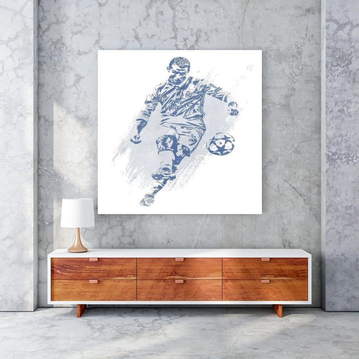 Wadi Home blue and white soccer player action shot wall art, stylized depiction of a player kicking a soccer ball.