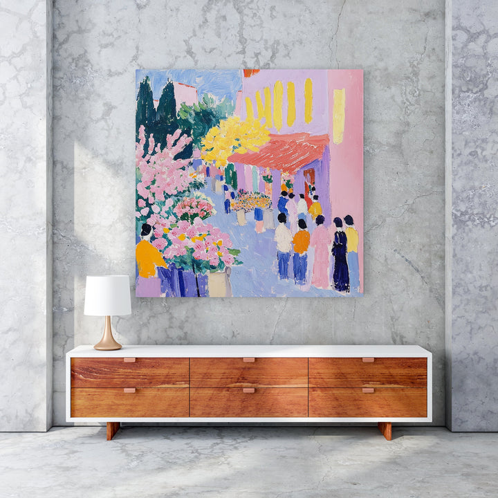 Wadi Home vibrant street scene painting with pink flowers, yellow trees, and people. Expressive style, bold colors.