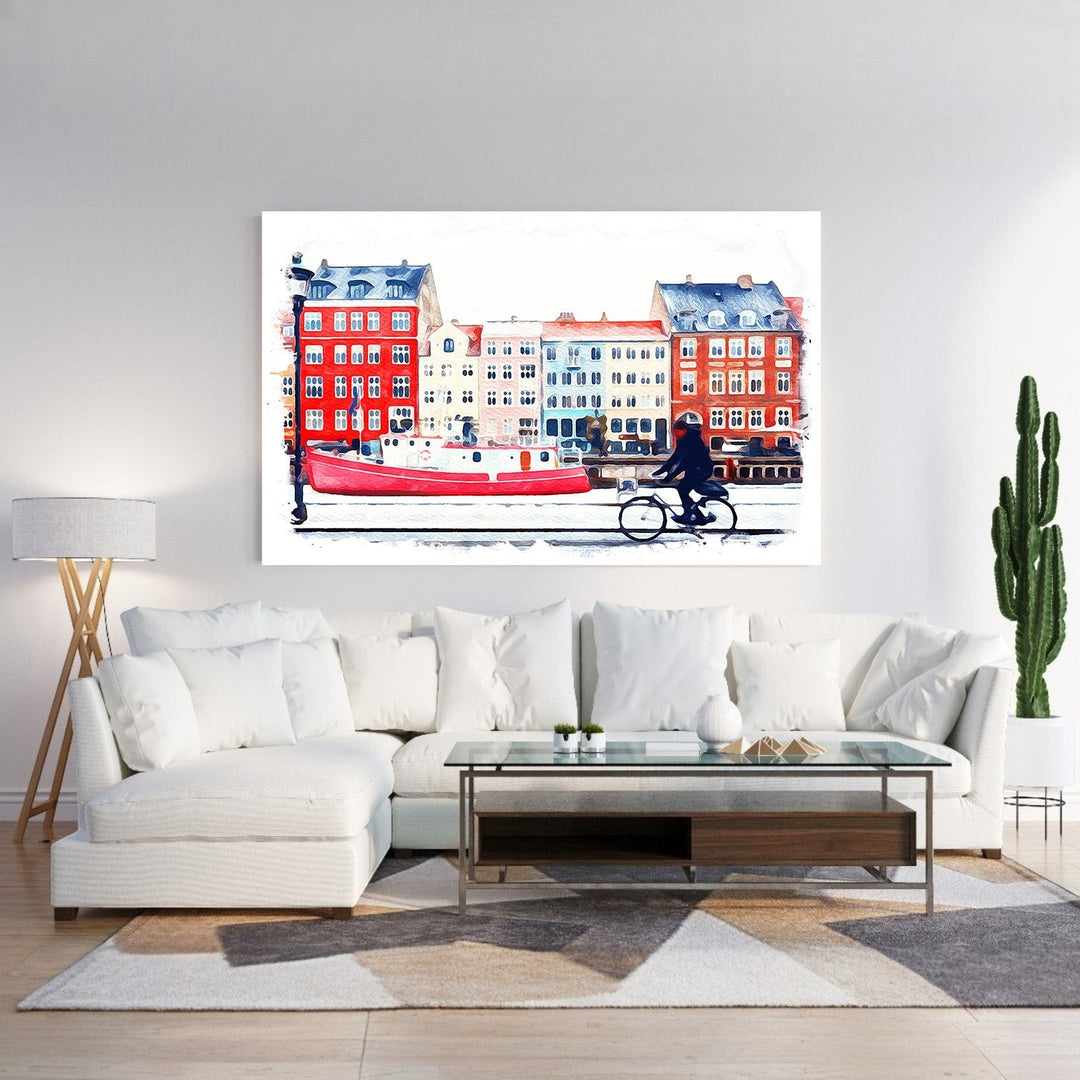 Wadi Home watercolor print of a European canal scene with a red boat, colorful buildings, and a person cycling.