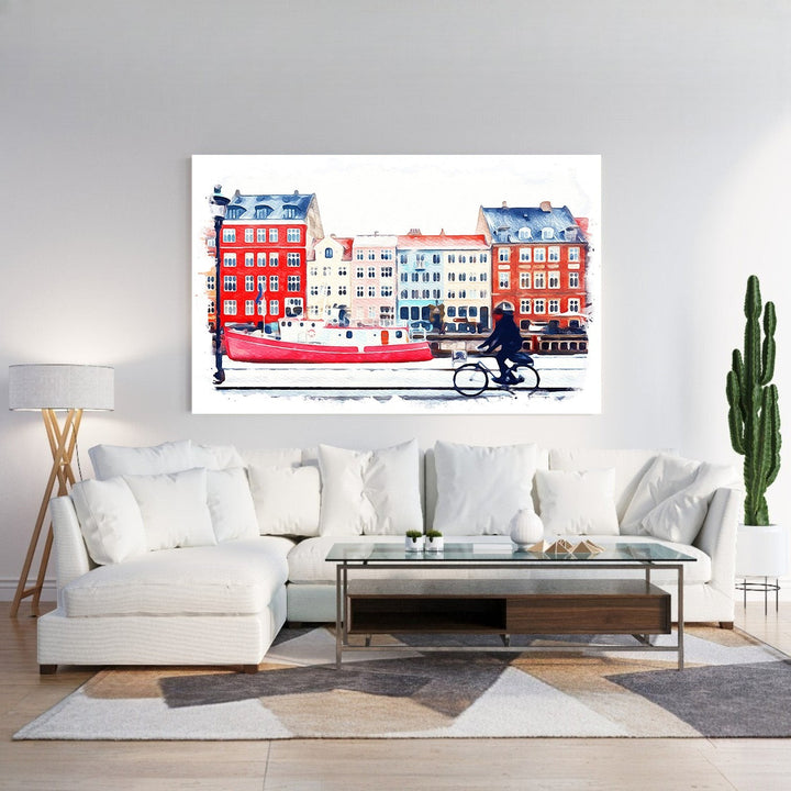 Wadi Home watercolor print of a European canal scene with a red boat, colorful buildings, and a person cycling.