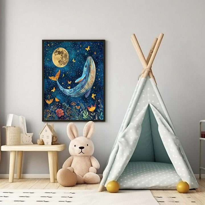 Wadi Home whimsical blue whale art with moon, stars, flowers, and butterflies for nursery decor.