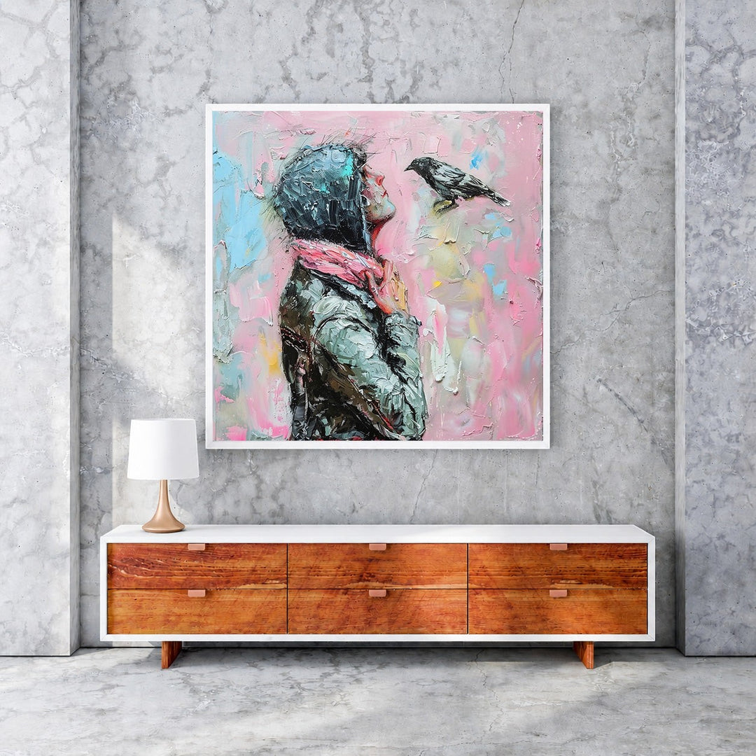 Wadi Home painting of a woman in a hooded jacket and pink scarf looking at a bird against a textured pink background.