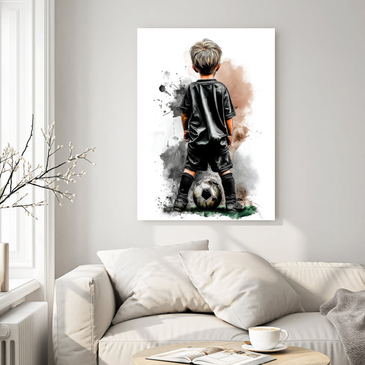 Wadi Home artwork of a young boy in a black soccer uniform with a ball at his feet, watercolor style.
