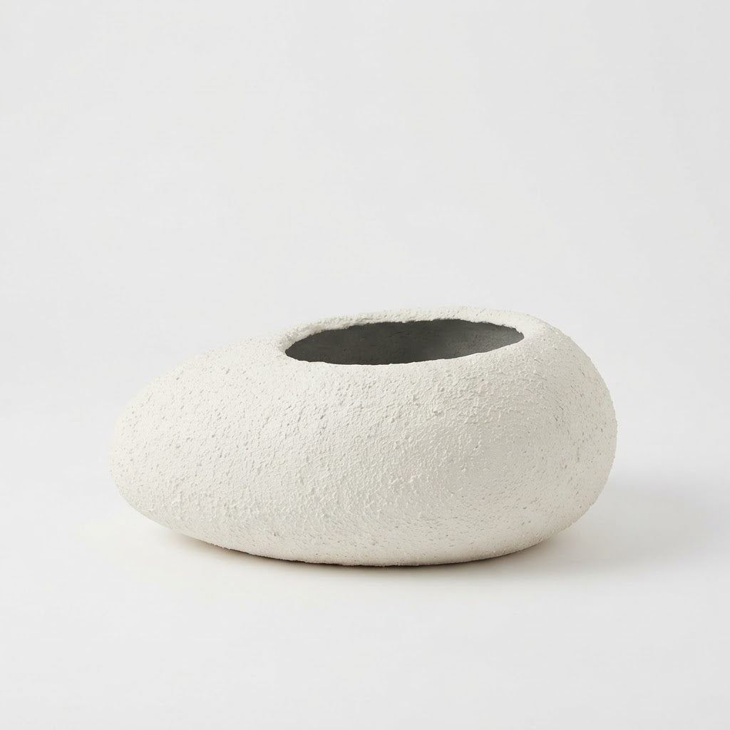 Low wide white textured fiberglass bowl planter with a circular opening on a plain white studio background.