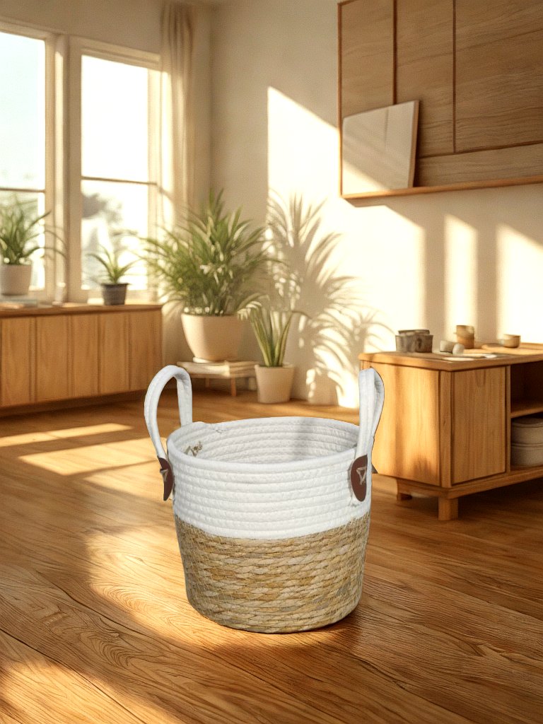 White and natural jute basket planter with loop handles and brown attachment tabs styled in a warm living room.