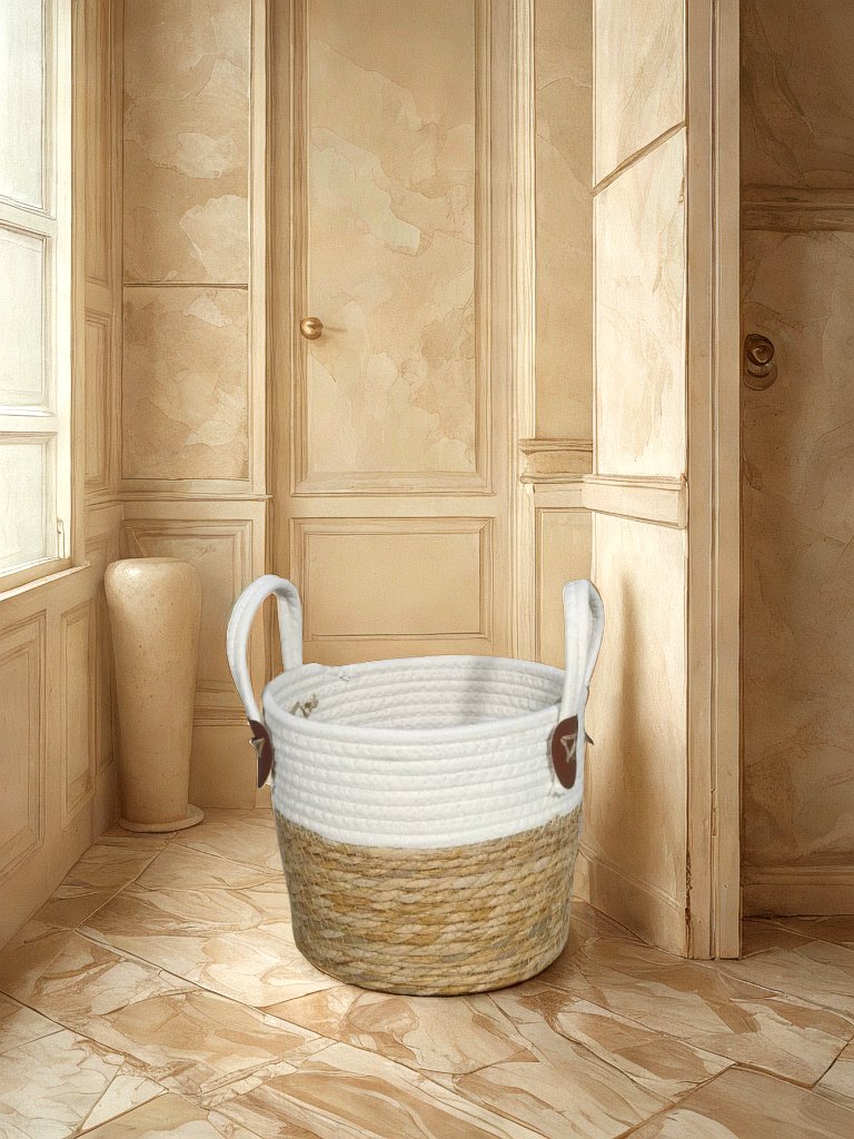 White and natural jute basket planter with loop handles and brown attachment tabs displayed in a neutral entryway.