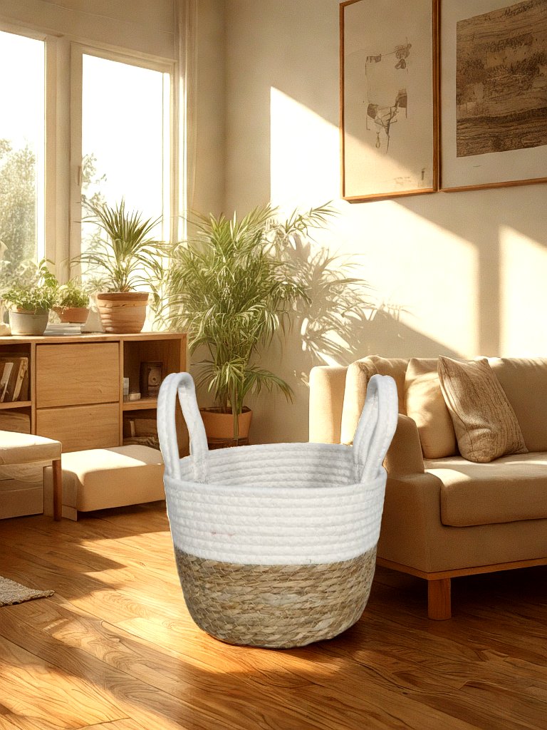 White and natural jute basket planter with white rope handles styled in a warm living room.